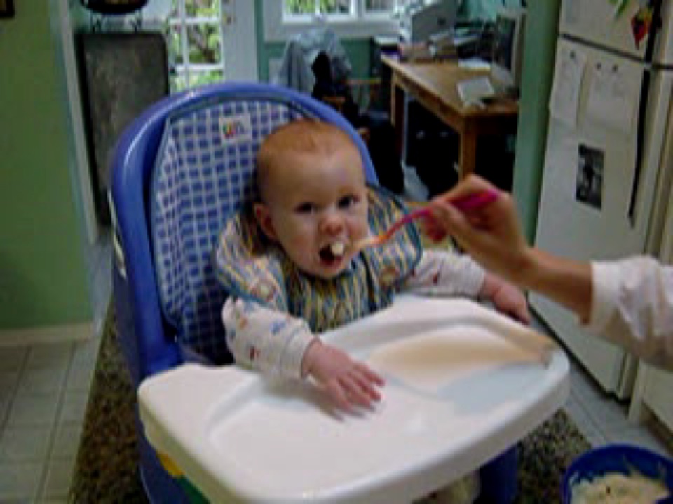 Little Alex gets to sit in the big-boy chair for the first time. Just as well it's made of easy-wipe plastic.