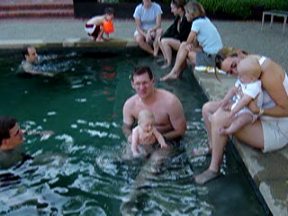 Alex takes a dip in the pool with his chums. He loves splashing the water!