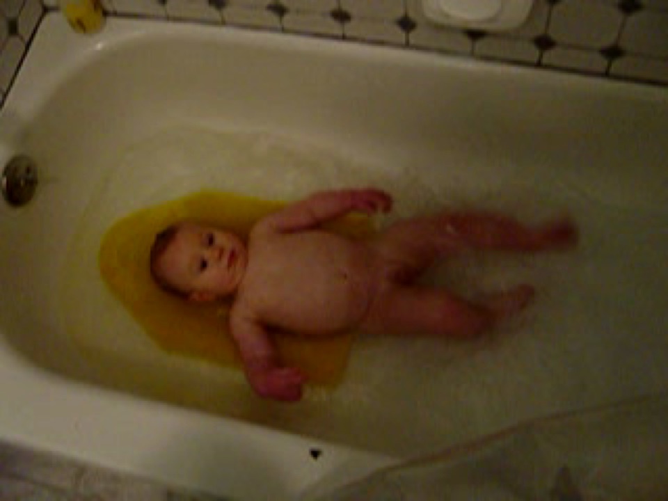 Here's Alex's favorite pastime - bathtime, where he gets to splash mummy and daddy!