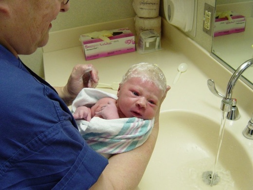 His first bath, 2 hours after he was born. I bet he's wondering what's going on.