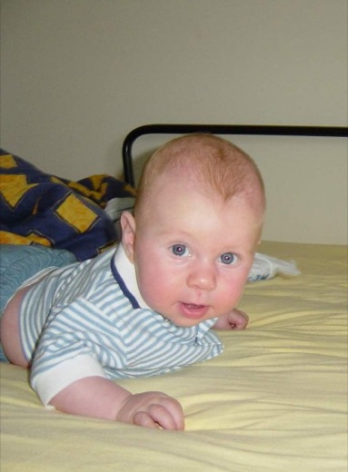 Here Alex lifts his head for long enough to give mummy an endearing smile on the 4th of July. I had to inform him that this didn't look much like a real pushup, and so he needed to do another ten.