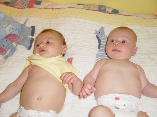 Another shot of Alex and Marco. They gurgle at each other, but it's too early to tell what they are talking about "Hi, I'm Alex, does your mummy feed you lots? Really? Hey, cool stroller by the way, damn, you got the sports wheels on that one."