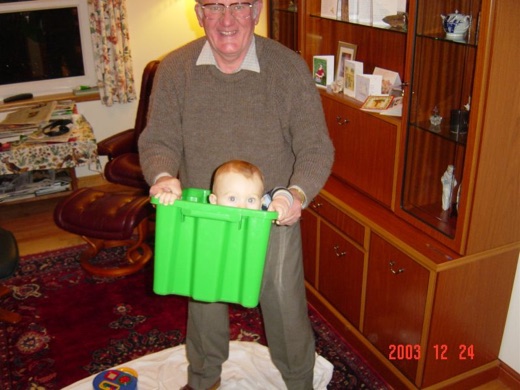 Alex learned to crawl in Scotland! Here his grandad plays airplanes with him in a green box. (See video also).