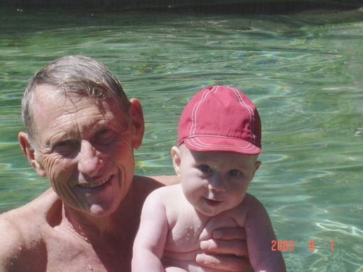 Here's Alex and grandfather in the pool. Next he got to play banging measuring spoons together. A big day for a little boy...