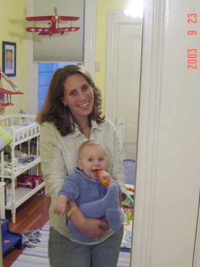 Alex and mummy pose in front of the mirror in Alex's little room. Alex is teething now, so now he has a favorite carrot.