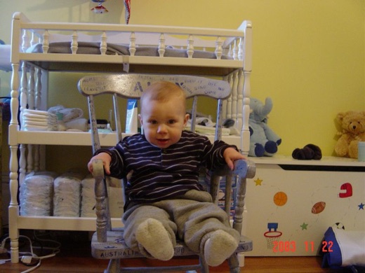 Alex got a rocking chair from his nephew and niece Will and Sally. Now that he's a big boy, he gets to sit on it.