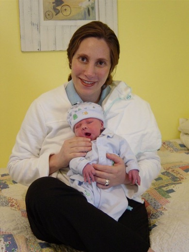 Emily holding Alex in our specially prepared baby room.